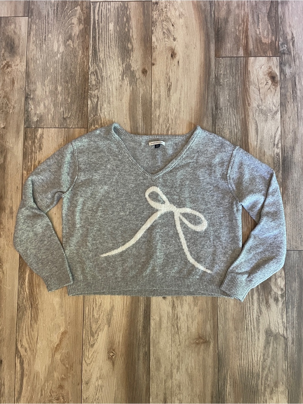 American Eagle Outfitters Gray V-Neck Sweater with Cream Bow